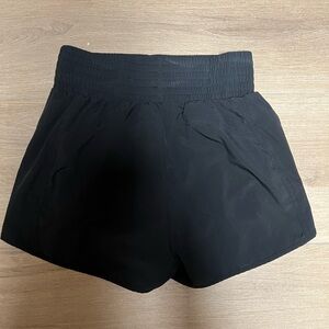 Black High-Rise Performance Shorts with Zipper Pocket